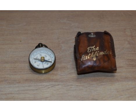 An early-mid 20th Century miniature 'The Pathfinder' magnetic compass, with leather case
