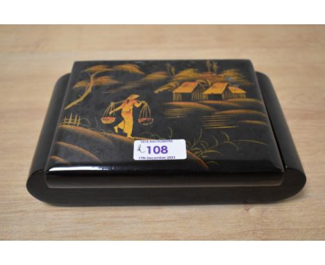 A lacquered jewellery box having Oriental scenic decoration , containing a small selection of  vintage jewellery including ha