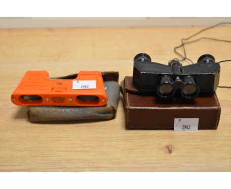 A pair of vintage bakelite opera binoculars, by Kershaw, with case, and another pair by Theatis