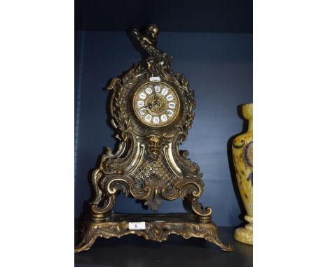A 20th Century German gilt metal mantel clock, of French style, with two train movement and enamelled Roman numerals, measuri