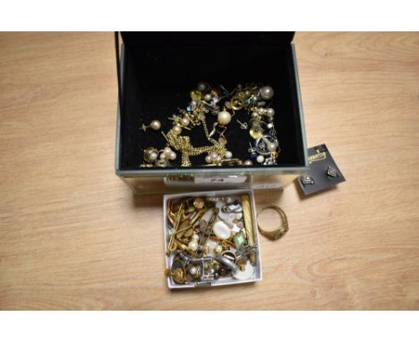 A mirrored jewellery box containing assorted costume jewellery, including gold coloured, enamelled, and other cufflinks, simu