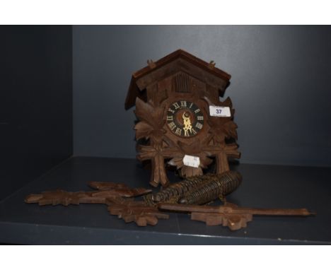 A mid-20th Century German Forestall cuckoo clock, in the Black Forest style, with ebonised chapter ring and roman numerals, c