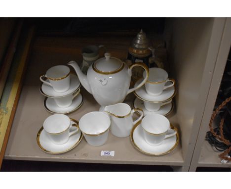 A Mayfair china tea service on cream ground with gilt trim, a green Wedgwood jasperware jug, and a German lidded stein