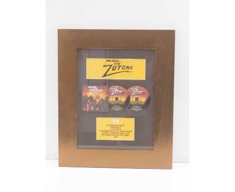 ZUTONS - A framed and glazed BPI award for sales in the UK of more than 600,000 copies of 'The Zutons who Killed the Zutons' 