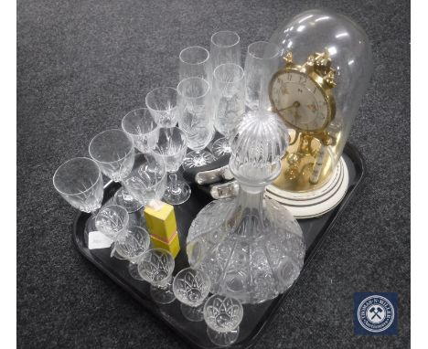 An anniversary clock under shade, decanter, drinking glasses, two hip flasks and a bugle band harmonica 