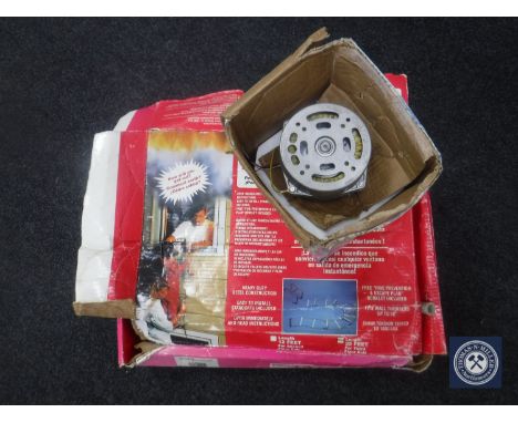 A boxed ResQLadder fire escape ladder together with a motor