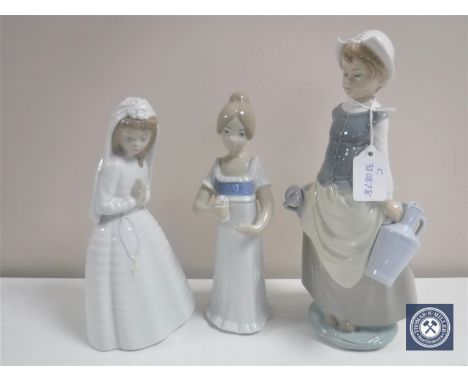 A Lladro figure of a water carrier, Nao figure and a Spanish figure 