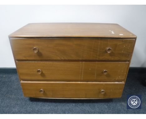 An Ercol elm three drawer chest 