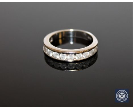 A 14ct gold twelve stone diamond half eternity ring, round brilliant cut stones approximately 1ct, size M 1/2.