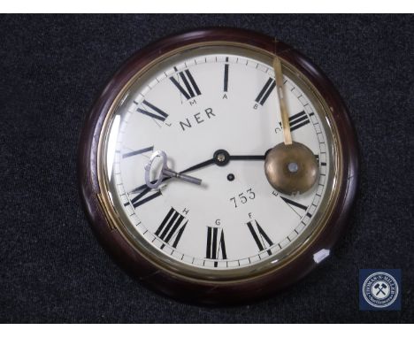 A circular NER station clock with chain driven single fusee movement, with pendulum and key 