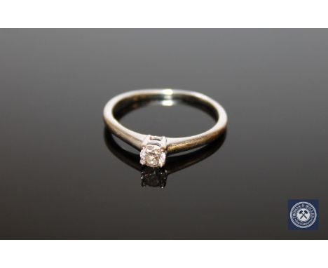 An 18ct white gold round cut diamond solitaire ring, approximately 0.25ct, size P.