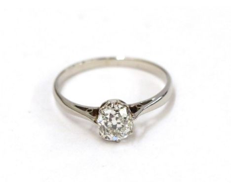 A diamond solitaire ring, the old cut diamond in a white claw setting, to a tapered shoulder plain polished shank, estimated 