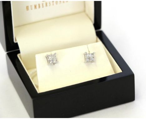 A pair of diamond cluster earrings, four princess cut diamonds in white claw settings, total estimated diamond weight 0.40 ca