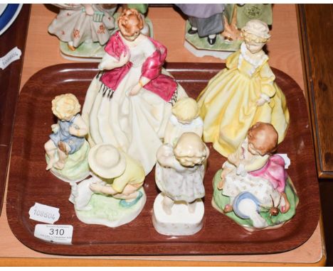 A group of seven Royal Worcester figures comprising; FIrst Dance, Grandmothers Dress, Teatime, Christopher, Only Me and Joan,