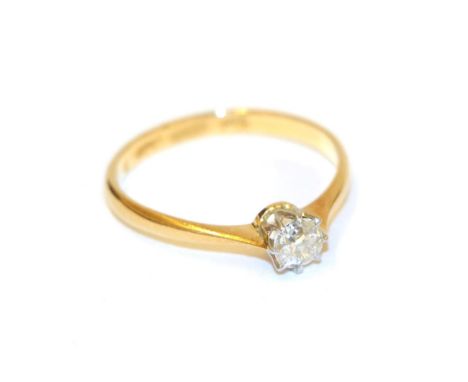 A diamond solitaire ring, the round brilliant cut diamond in a white claw setting, to a yellow tapered shoulder plain polishe