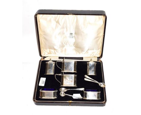 A George V silver condiment set, by R. and W. Sorley, Chester, 1928, each piece oblong and with canted corners, comprising: a