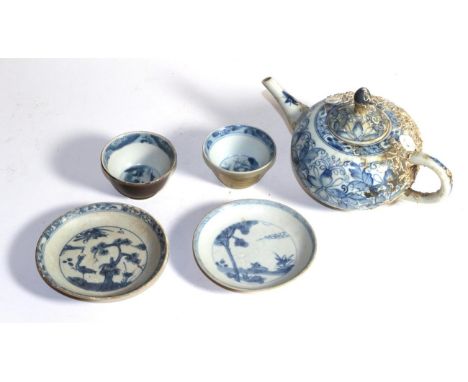 A Chinese teapot from the Camau ship wreck, circa 1730 and two tea bowls and saucers