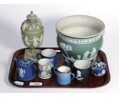 A group of Wedgwood Jasper ware including a vase, urn and cover, twin handled cups etc.  miniature teapot lacking cover, vase