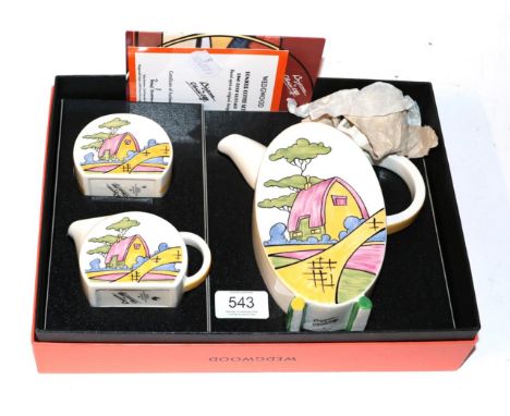 A boxed Wedgwood 'Bizarre by Clarice Cliff' Bonjour coffee set