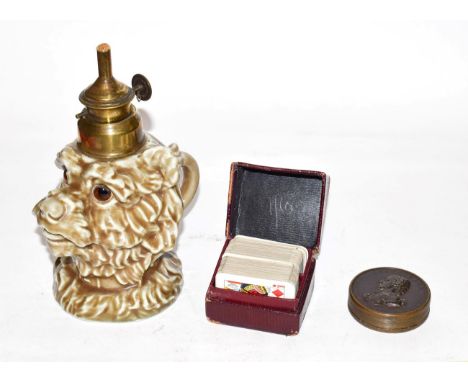 A brass mounted pottery lamp, modelled as the head of a dog, with brass mounts; together with: a brass box, made from an 1816