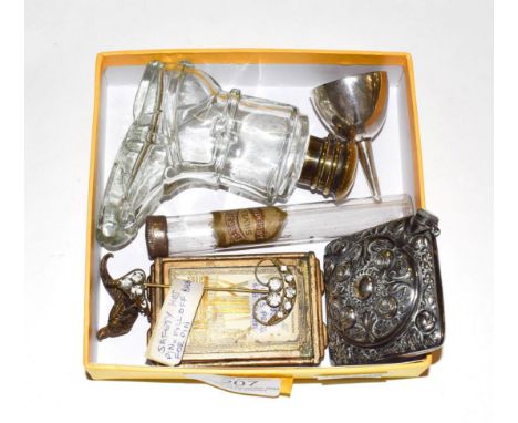 A group of scent-bottles and other items, including: an Alpaca scent-bottle cum compact; a glass scent bottle in the form of 