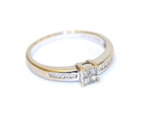 A diamond cluster ring, the central cluster formed of four princess cut diamonds, to round brilliant cut diamond set shoulder