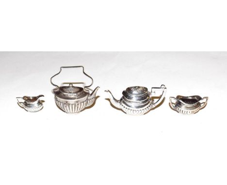 An Edward VII and Elizabeth II miniature silver toy tea-service, comprising; a kettle, by Levi and Salaman, Birmingham, 1905,