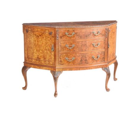 BOW FRONT WALNUT SIDEBOARD FITTED WITH THREE DRAWERS & CUPBOARD EITHER SIDE WITH BRASS DROP HANDLES.RAISED ON CARVED CABRIOLE