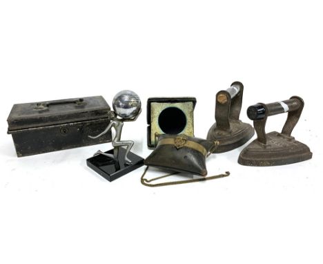 A mixed lot to include an art deco table lighter in the form of a woman holding a sphere, an ebonised wood and brass purse, a