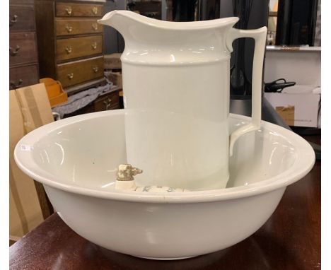 A white ceramic wash jug and bowl, 40cmD; together with a ceramic gin barrel 