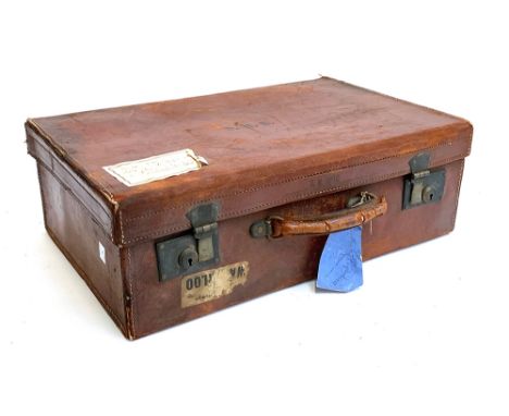 A vintage leather suitcase, monogrammed D.M.B, 51cmW 