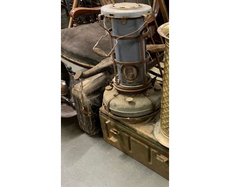 An ammunition box, vintage oil heater and jerry can 