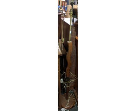 A hardwood standard lamp with wavy central carved section; together with a folding stool 