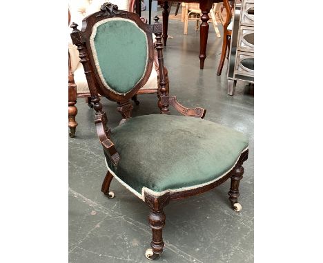 A small Victorian salon chair on ceramic casters 