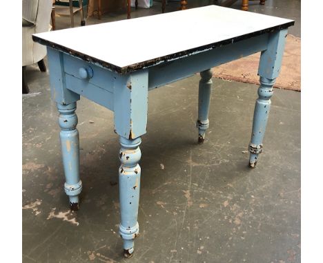 A vintage blue formica topped table, single end drawer, on turned legs, 99x46x75cmH 