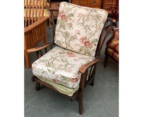 An Ercol stickback open armchair, with cushions, 81cmW 