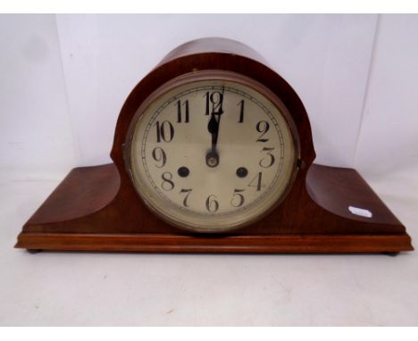 A mahogany cased German 8 day mantel clock with silvered dial