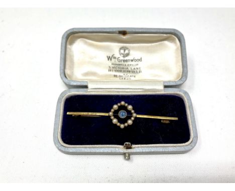 An Edwardian 15ct gold sapphire and seed pearl bar brooch  CONDITION REPORT: 3.2g