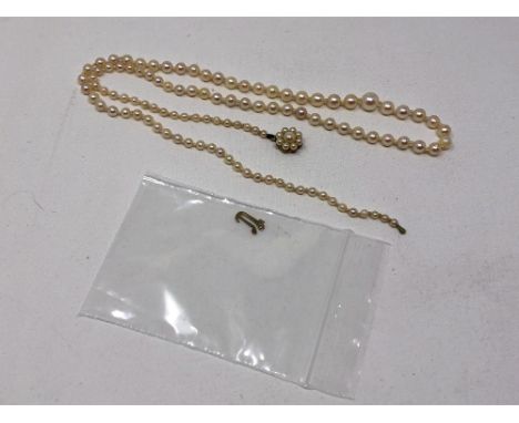 A single strand cultured pearl necklace on 9ct gold clasp, length 56cm.  CONDITION REPORT: Clasp requires attention. 