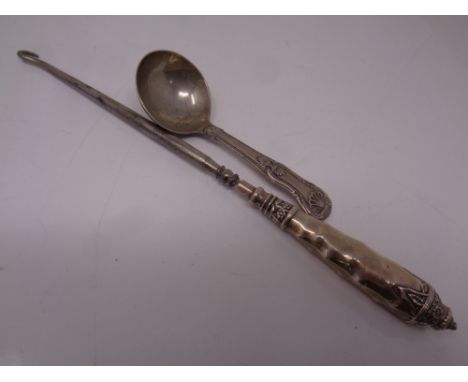 A Birmingham silver caddy spoon together with a silver handled button hook 