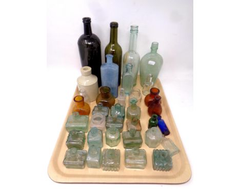A tray of antique and later glass and ceramic bottles 