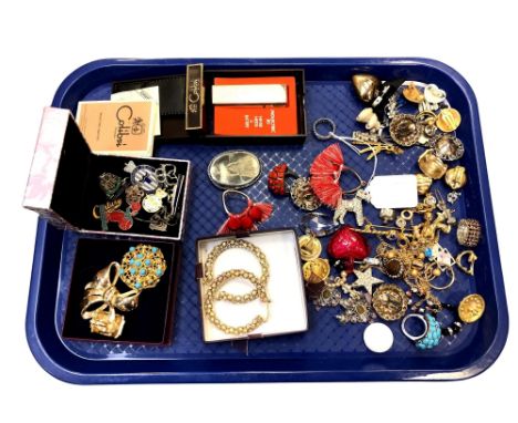 A collection of costume jewellery, Calibri lighter in box with original instructions, badges etc.