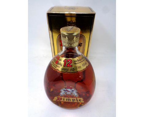 A 1 litre bottle of Dimple De Luxe Scotch whisky 12 years old in presentation box 