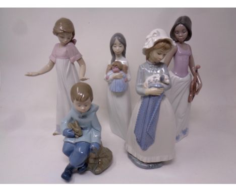 Five Nao figures to include Girl with puppy, Girl with Violin, Girl with doll, Girl stood with hands apart and Boy seated wit