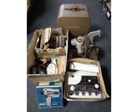 A Bell &amp; Howell projector in case together with a further super 8 projector, film reels, cine camera etc
