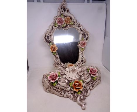 A Capodimonte flower encrusted china framed wall mirror with matching wall shelf