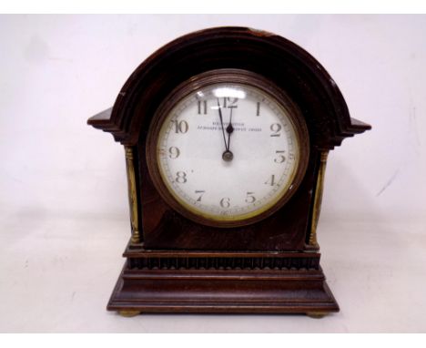 An antique mahogany and brass cased mantel clock retailed by Bravington Ludgate Hill, Kings Cross.