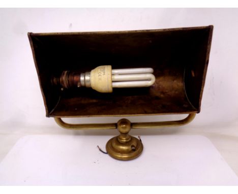 A vintage brass picture light.