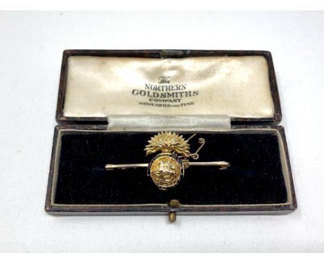 A 15ct gold and enamel Northumberland Fusiliers bar brooch  CONDITION REPORT: 7g 