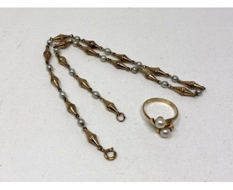 A 9ct gold pearl ring, together with a yellow metal and pearl necklace.   CONDITION REPORT: Ring 2.3g. Necklace apparently un